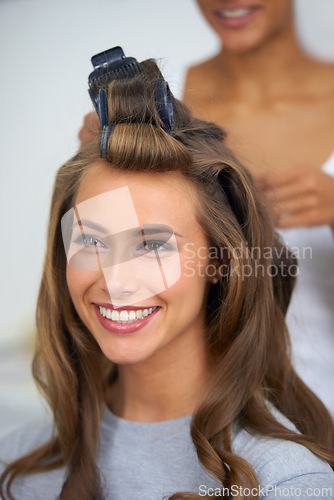 Image of Face, smile and hair curlers with woman in salon for professional shampoo or keratin treatment. Beauty, makeup and haircare with happy young model backstage or behind the scenes for cosmetic makeover