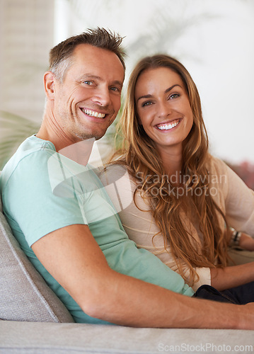 Image of Couple, portrait with smile and love in marriage, life partner with support and relax together for bonding at home. People on sofa, trust and care for commitment, loyalty and respect with happiness