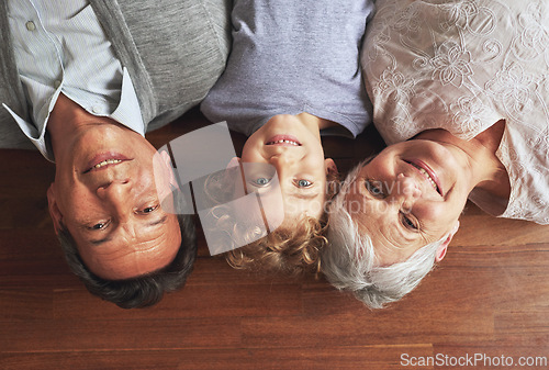 Image of Portrait, grandparents and boy on the floor, love and bonding together with joy or apartment. Family, face or old man with elderly woman, kid or grandchild with fun or cheerful with home or vacation