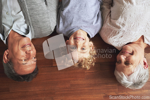 Image of Portrait, grandparents and boy on the wooden floor or bonding together with vacation or apartment. Family, face or elderly man with old woman, grandkid or child with fun or cheerful with home or love