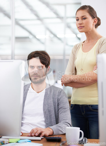 Image of Coworkers, computer and collaboration in planning for proposal, online and internet for research. Business people, serious and teamwork on report in workplace, manager and solution for accounting