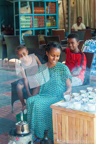 Image of Ethiopian traditional Coffee ceremony, crafting street bunna coffee, Melkasa Etiopia