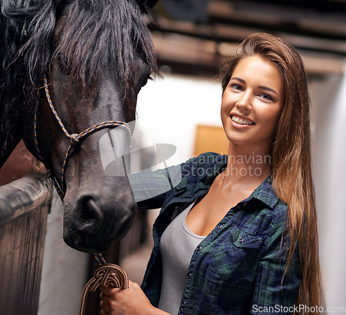 Image of Woman, portrait and smile with horse in stable for bonding, sports training and recreation in Texas. Stallion, cowgirl and animal or face in barn with smile for healthy livestock, hobby and pet care