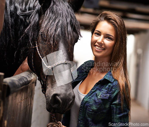 Image of Woman, portrait and happy with horse in stable for bonding, sports training and recreation in Texas. Stallion, cowgirl and animal or face on barn with smile for healthy livestock, hobby and pet care