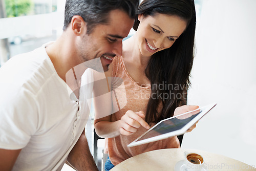 Image of Happy couple, love or tablet in restaurant to relax or bonding together on espresso date on social media. Man, woman or technology for choice in online shopping, cafe or surfing internet on honeymoon