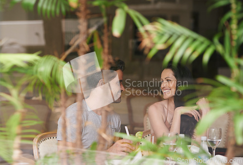 Image of Happy couple, restaurant and date with romance for meal, dinner or enjoying anniversary at hotel. Man and woman with smile for dining, eating or romantic hospitality at lodge or indoor accommodation