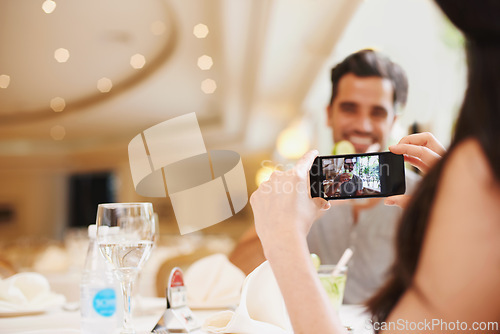 Image of Restaurant, couple taking picture and food with love and digital app with social media or happy. People, man and woman with smartphone or photograph with influencer or cafe for Valentines day or date