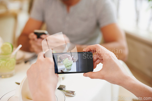 Image of Cafe, picture and couple with cellphone, screen and connection with Valentines day and photograph. Date, man and woman with smartphone and digital app for memory and romance with restaurant or luxury