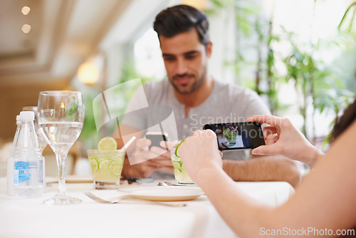 Image of Restaurant, screen and couple taking picture, food and lunch with digital app and photograph. People, date or couple with cellphone or influencer with social media or love with Valentines day in cafe