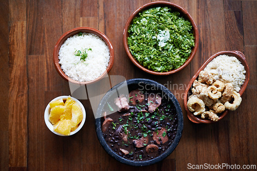 Image of Black beans, food and chilli lunch with above of Mediterranean cooking, vegan and nutrition for diet. Health, green and dish at restaurant or diner with organic salad and vegetable for Mexican dinner