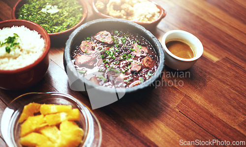 Image of Black beans, food and chilli lunch with closeup of Mediterranean cooking, vegan and nutrition for diet. Health, vegetables and dish at a restaurant with organic, salad and table with Mexican dinner