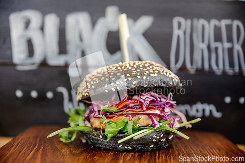 Image of Fresh colorful vegan burgers with vegetables on counter at summer local food market - close up view. Outdoor cooking, gastronomy, vegetarian, street food concept.