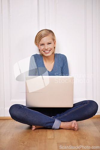 Image of Laptop, happy and portrait of woman on floor working on freelance project for remote job. Smile, technology and young female person sitting on ground with computer for online research at home.