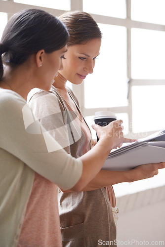 Image of Woman, paper and coffee in office with collaboration for teamwork, discussion and planning at workplace. Professional people, employees and document with explaining for help, partnership and ideas