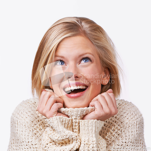 Image of Studio, woman and skincare with sweater, smile and vision with happiness and satisfaction. Model, jersey and fashion for winter, care and treatment with comfort clothes or cardigan with style