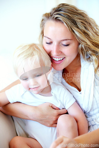 Image of Mom, toddler and together with love on couch for bonding, learning and relax with safety for kid. Mother, child and support with security for growth, development and family happy in home on sofa