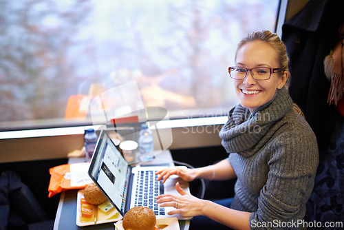 Image of Woman, train and portrait with laptop for travel journey on commute as destination blogger, communication or transportation. Female person, face and meal in coach in Canada, research or passenger