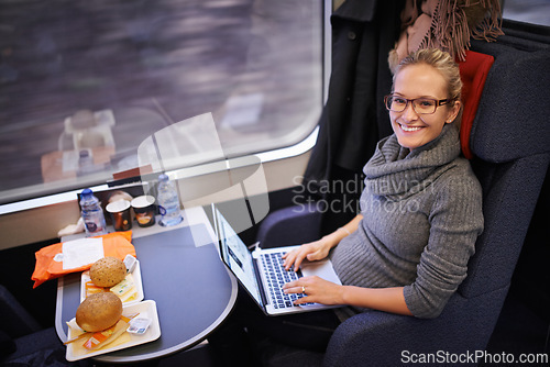 Image of Woman, train and portrait with laptop for commute journey for networking as travel blogger, communication or transportation. Female person, face and meal in coach in Canada, research or passenger