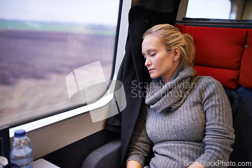 Image of Woman, train and sleep with travel or relax journey for holiday destination for tired, transportation or resting. Female person, window and commute in Canada with nap for peace, comfortable or trip