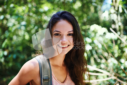 Image of Nature, hiking and portrait of woman in forest with backpack for outdoor adventure trail on vacation. Smile, travel and person with bag for trekking in woods on holiday or weekend trip in Canada.