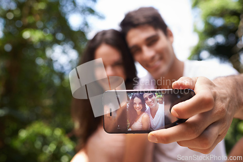 Image of Couple, selfie and phone screen for hiking in forest with smile for memory, post and web blog. Man, woman and profile picture for trekking, direction and jungle on app for social media in Colombia