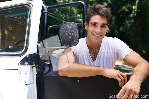 Image of Man, road trip and portrait in forest, happy and outdoor for drive, safari and vacation in summer. Person, pride and relax by car, transportation or journey in tropical jungle on holiday in Colombia
