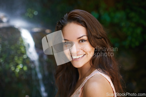 Image of Smile, waterfall or portrait of happy woman in forest or wilderness for outdoor trekking adventure. Park, face or female hiker walking in woods or nature for travel, exercise or wellness on holiday