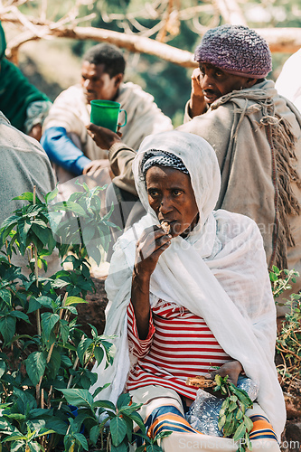 Image of Orthodox christian Ethiopian people behind famous rock-hewn church, Lalibela Ethiopia people diversity,