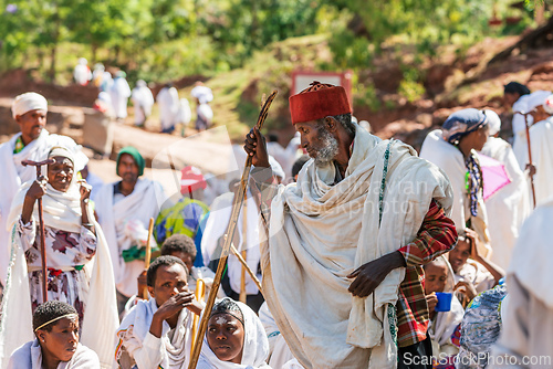 Image of Orthodox christian Ethiopian people behind famous rock-hewn church, Lalibela Ethiopia people diversity,