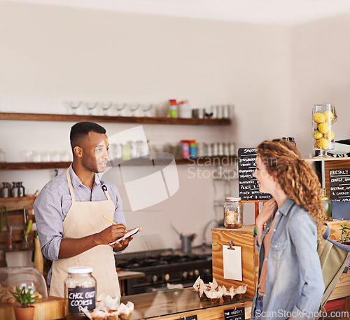 Image of Woman, coffee shop and waiter with writing at counter for shopping, purchase and lunch at cafe. Female person, small business and barista with notepad for discussion, order and customer service