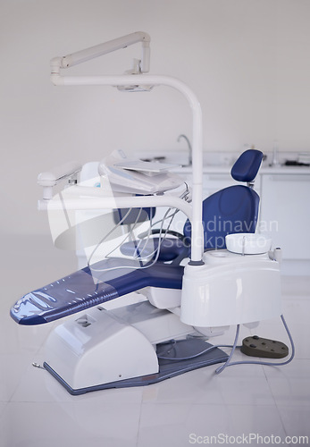 Image of Dental, chair and healthcare at dentist office, medical equipment or furniture for oral health and wellness. Orthodontics, dentistry and treatment workspace for mouth care at orthodontist clinic