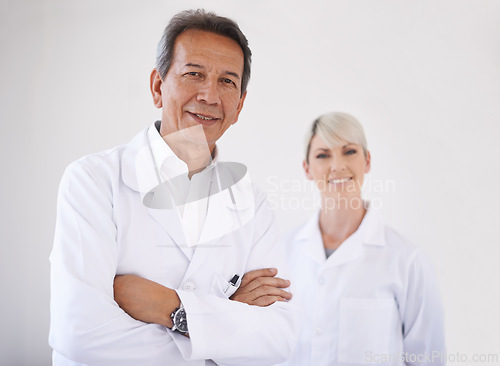 Image of Portrait, dentist and woman in clinic together with confidence, expert advice and orthodontics for medical health. Dental medicine, healthcare and professional with pride, arms crossed and technician