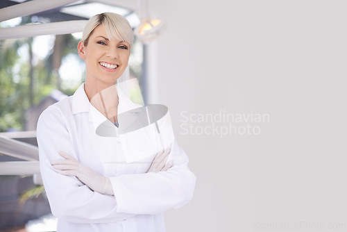 Image of Portrait, dentist and doctor woman in clinic with confidence, expert advice and orthodontics for medical health. Dental medicine, healthcare and professional with pride, arms crossed and oral service