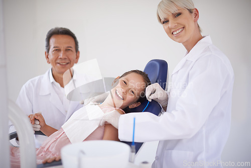 Image of Portrait, dentist and technician with child in clinic for expert advice, orthodontics and medical health. Dental medicine, healthcare and professional man with girl, woman and oral service in office