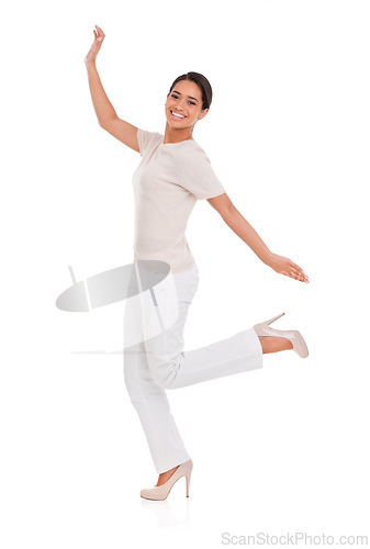 Image of Woman, winner and celebration in studio for success, winning and achievement with fashion, bonus or sale. Portrait of an excited person with heels, yes and stylish clothes on a white background