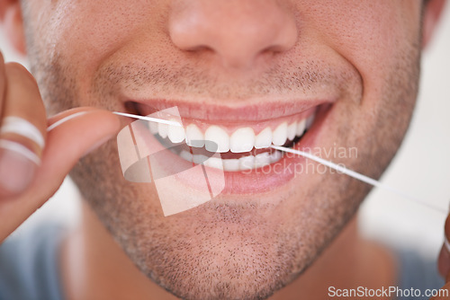 Image of Dental, floss and closeup of man with teeth whitening, fresh breathe and cavity prevention for health and hygiene. Oral care, string or thread for orthodontics with veneers and mouth cleaning