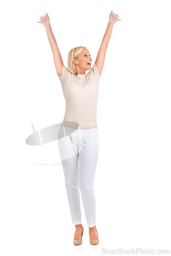 Image of Woman, winner and arms up in studio for success, winning and achievement with fashion, bonus or sale. Excited person in heels and stylish clothes with yes, wow and celebration on a white background