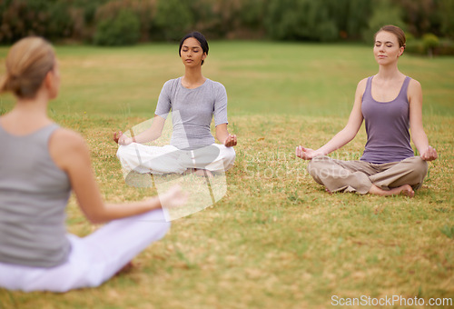 Image of Lotus, group and meditation outdoor for yoga, healthy body and mindfulness exercise to relax. Peace, zen and calm women in padmasana in nature for balance, spirituality or breathing with instructor