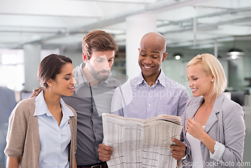 Image of Business team, read and looking at newspaper, stock market and economic state of the company in trading. Diverse, colleagues and staff for career, startup and happy for agency and investment