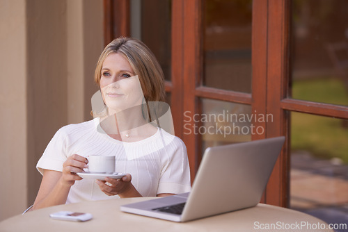 Image of Thinking mature woman, coffee or remote working on outside table, home garden and entrepreneur for small business. Freelance writer, blogger or self employed, planning or research for ideas on laptop