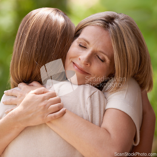 Image of Parent, daughter and hug with support outdoors in nature for mothers day, care and affection for gratitude. Mom, girl child and bonding together on summer vacation for love, smile and closeup