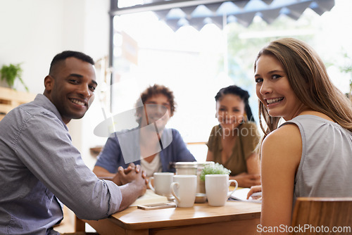 Image of Portrait, diversity and university friends in restaurant together for bonding, college social and study. Coffee shop, brunch and people relax in cafe with books, drinks and sharing happy discussion