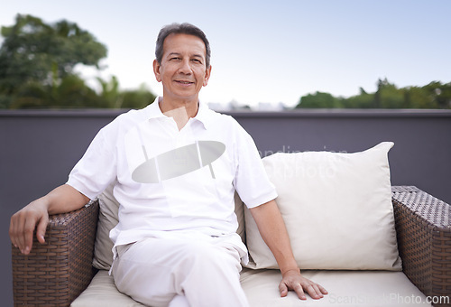 Image of Outdoor, portrait and man relax on couch of house with smile on face for comfort and sun in patio. Mature person, happy and enjoying nature, outside and home for retirement, senior and elderly