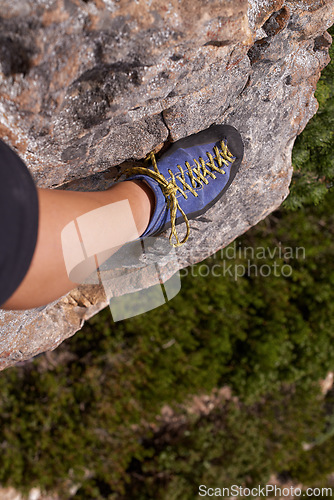 Image of Closeup, leg or shoe for rock climbing, fitness or nature for health, adventure or outdoor activity. Mountain climber, cliff and trees for healthy exercise, sports and leisure in Puerto Rico