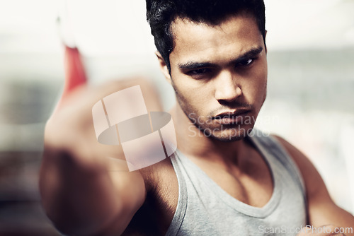 Image of Man, portrait and boxing with confidence, fight and fists ready to punch in match for training and exercise. Male person, workout and cardio in gym, mma and boxer for sports and combat in vest