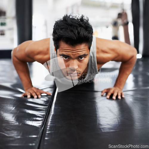 Image of Mexican man, strong and training for fitness, sport and health for boxer on mat with pushups. Male person, wellness and exercise for workout, athlete and cardio strength for commitment in boxing gym