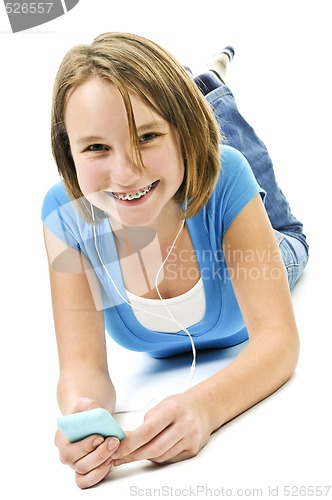 Image of Teenage girl listening to music