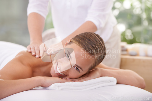 Image of Woman, portrait and wellness at spa for massage, health or skin care for luxury, physical therapy or peace. Female person, happy and relaxed for lifestyle, body or wellbeing on table, calm or natural