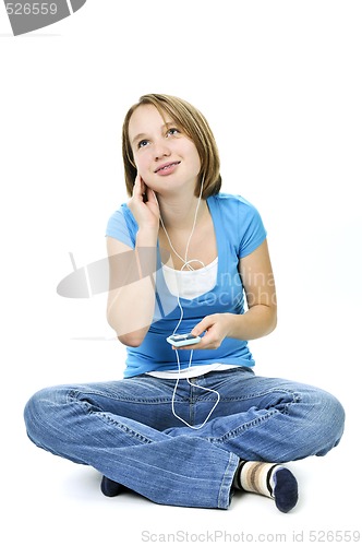 Image of Teenage girl listening to music