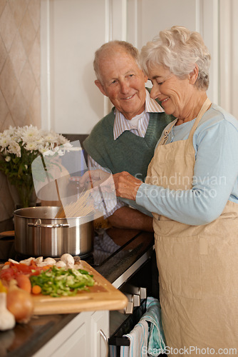 Image of Senior couple, cooking and stove top in kitchen, food preparation and love at home. Elderly people, healthy meal and organic ingredients for nutrition, vegetables and diet for detox in retirement